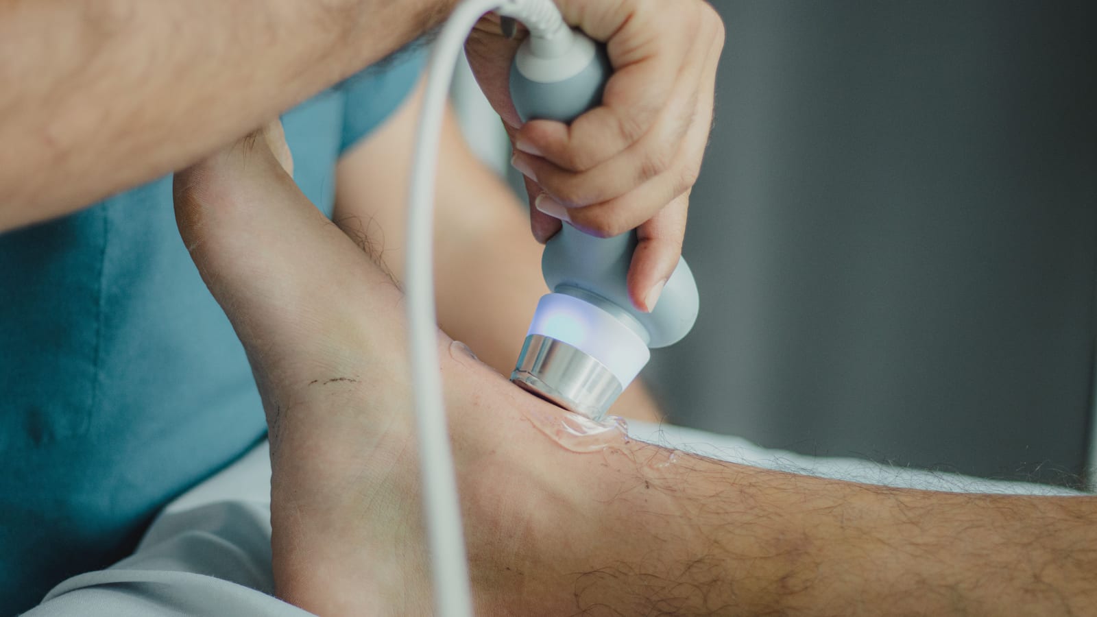 A treatment handpiece being applied to a patient’s lower leg at OC Weight Loss and Med Spa in Mission Viejo